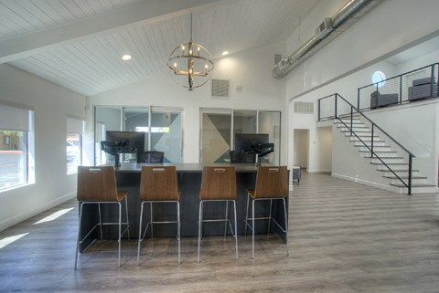 A bar area with a staircase in the background.