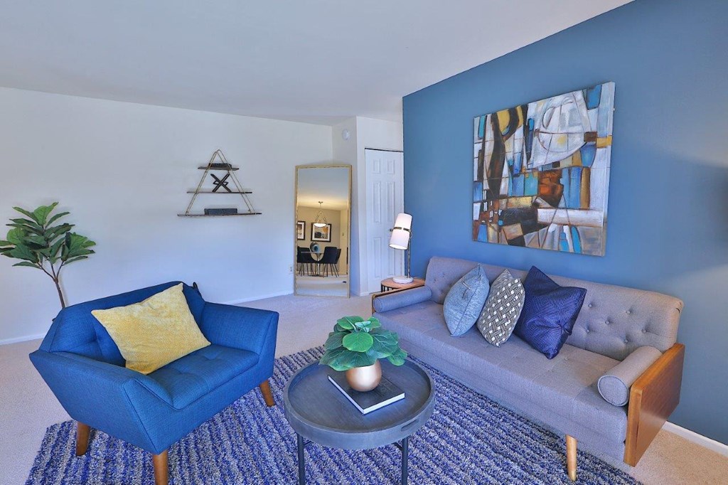 a living room with a blue wall and a couch