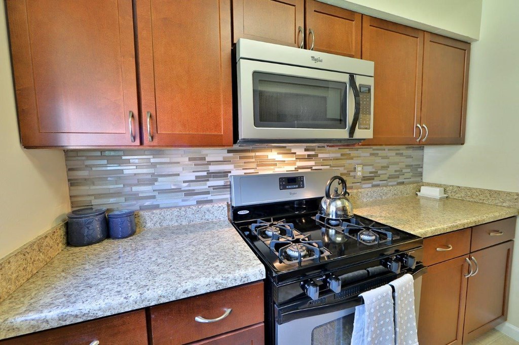 a kitchen with a stove and a microwave