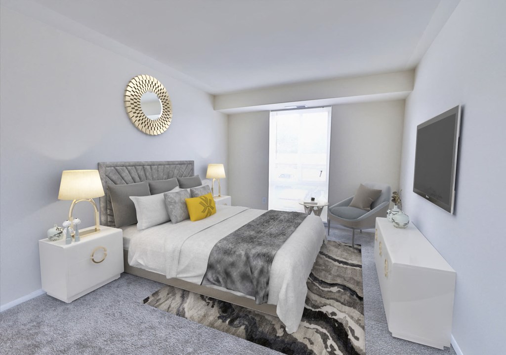 a bedroom with a bed and a tv