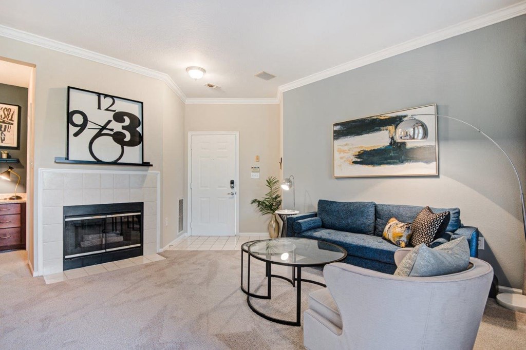 a living room with a couch and a fireplace