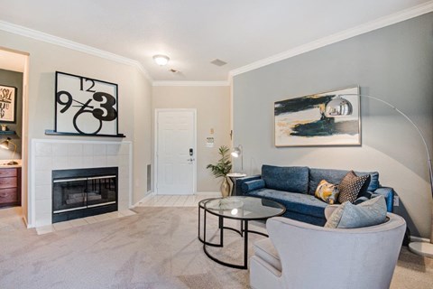 a living room with a couch and a fireplace
