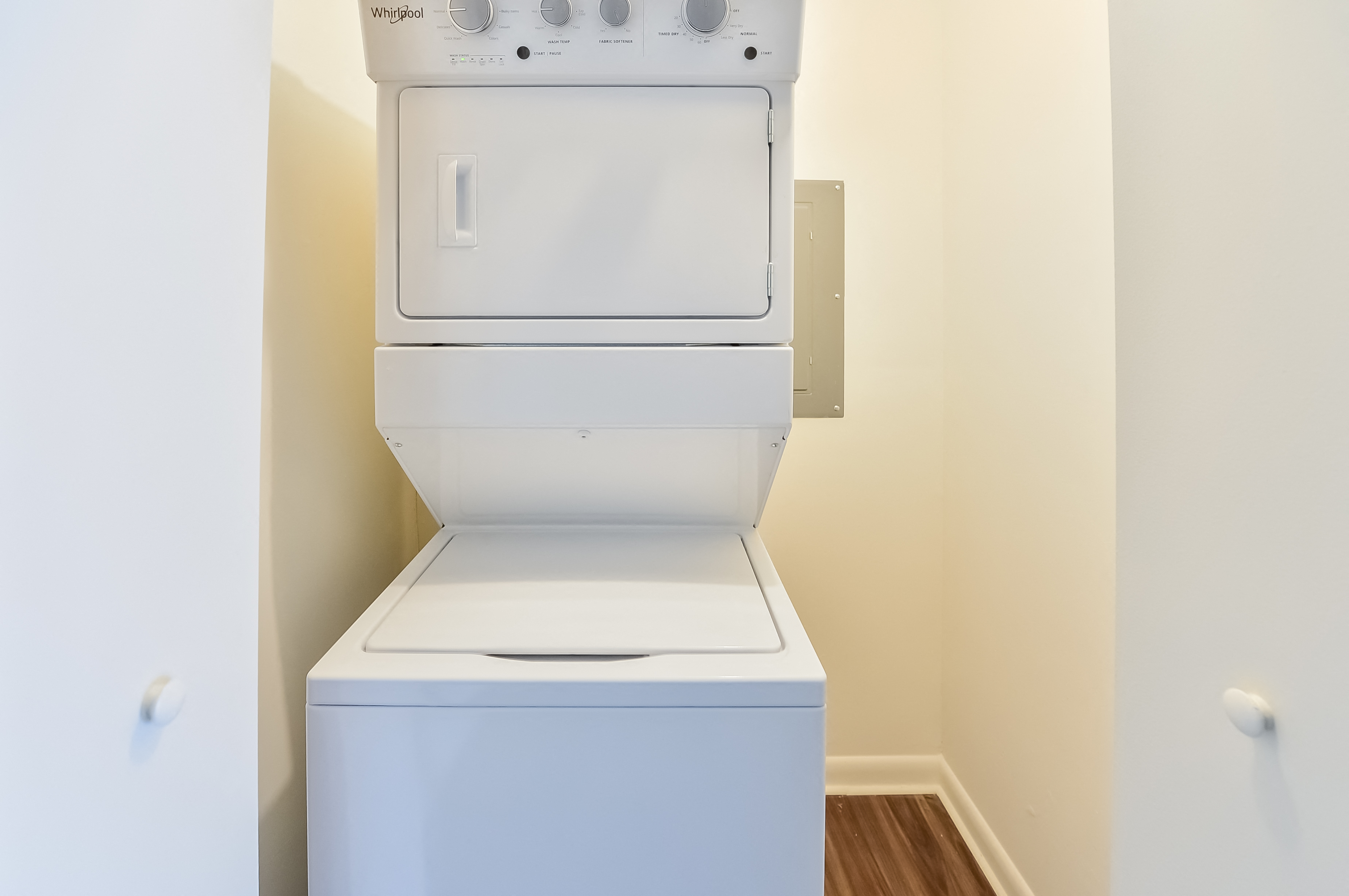 an empty laundry room with a washer and dryer