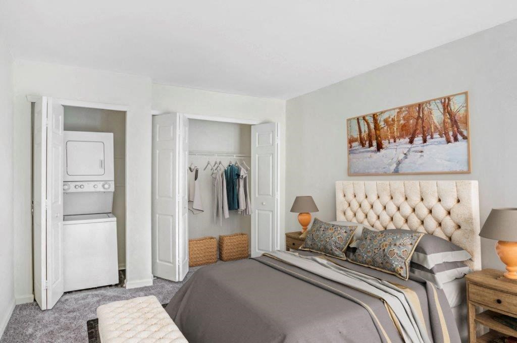 a bedroom with a bed and a closet