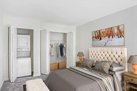 a bedroom with a bed and a closet