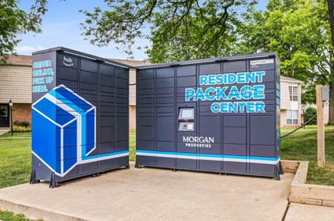 a large black container with a vending machine on the side of a sidewalk