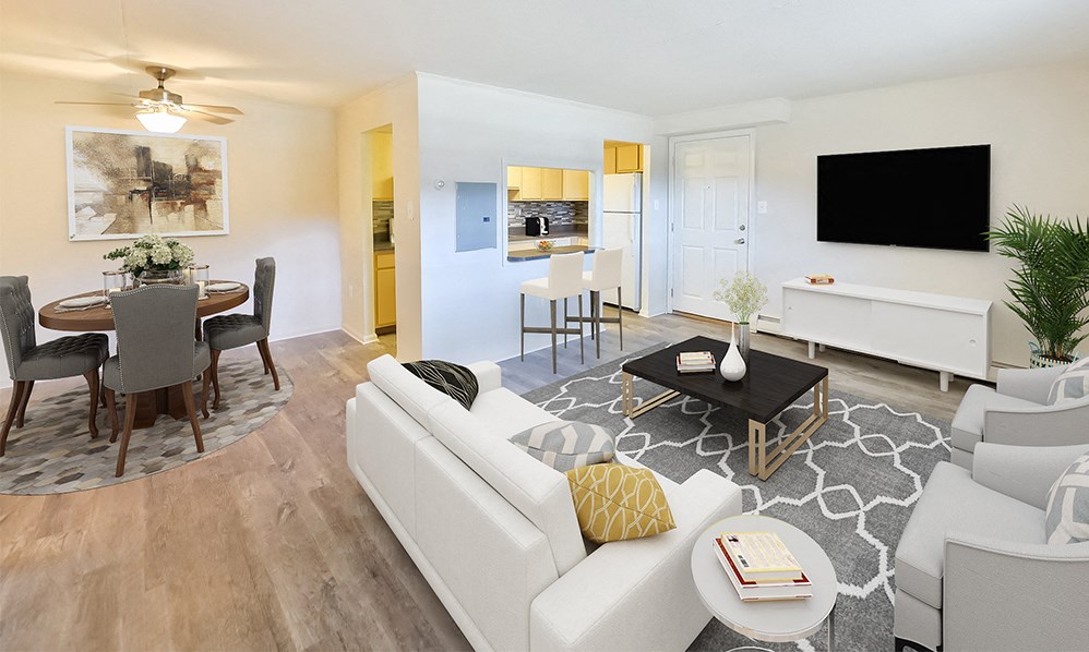 a living room and dining room with a couch and a table