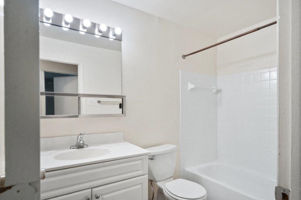 a bathroom with a sink toilet and a shower