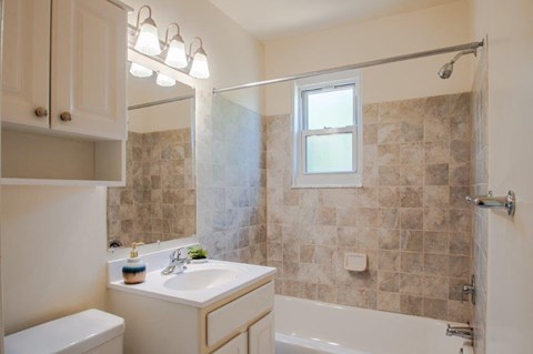 a bathroom with a sink and a bath tub