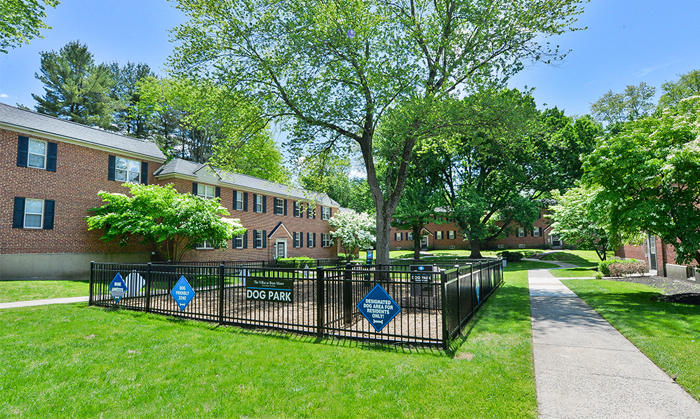 the yards are fenced off with a wrought iron gate