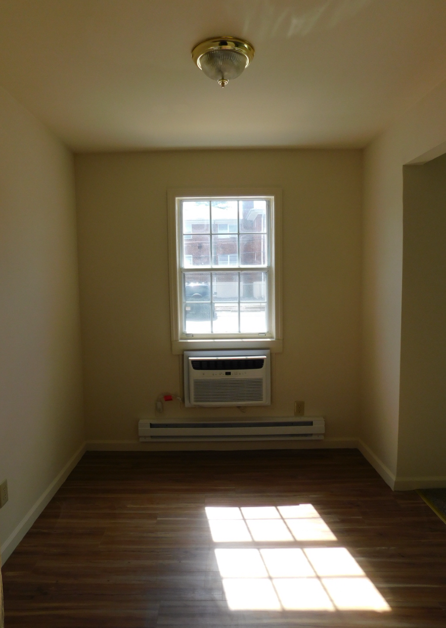 an empty room in a house with a window