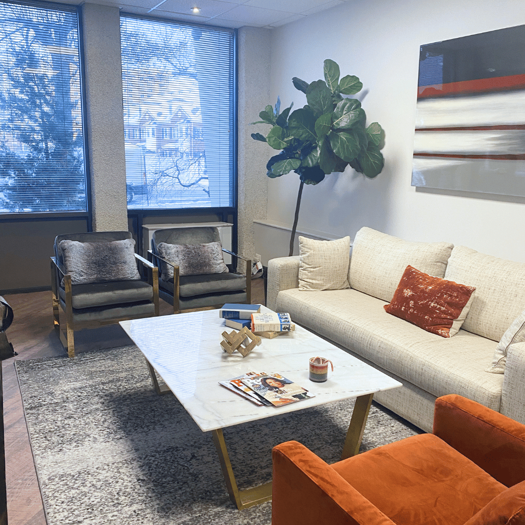 a living room with couches and chairs and a coffee table