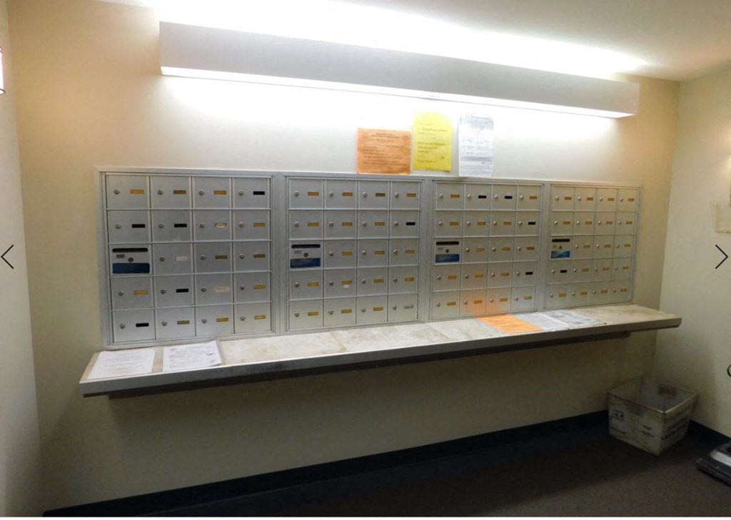 a locker room with a bunch of lockers on the wall