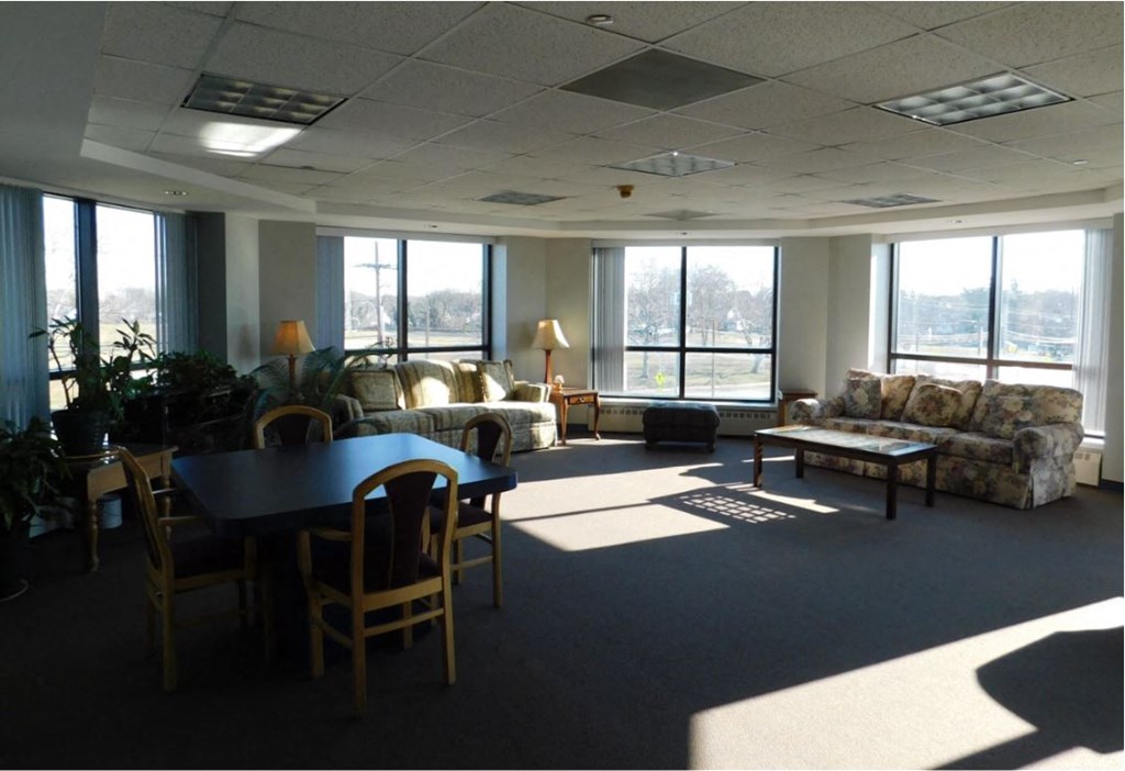 a large living room with couches and a table