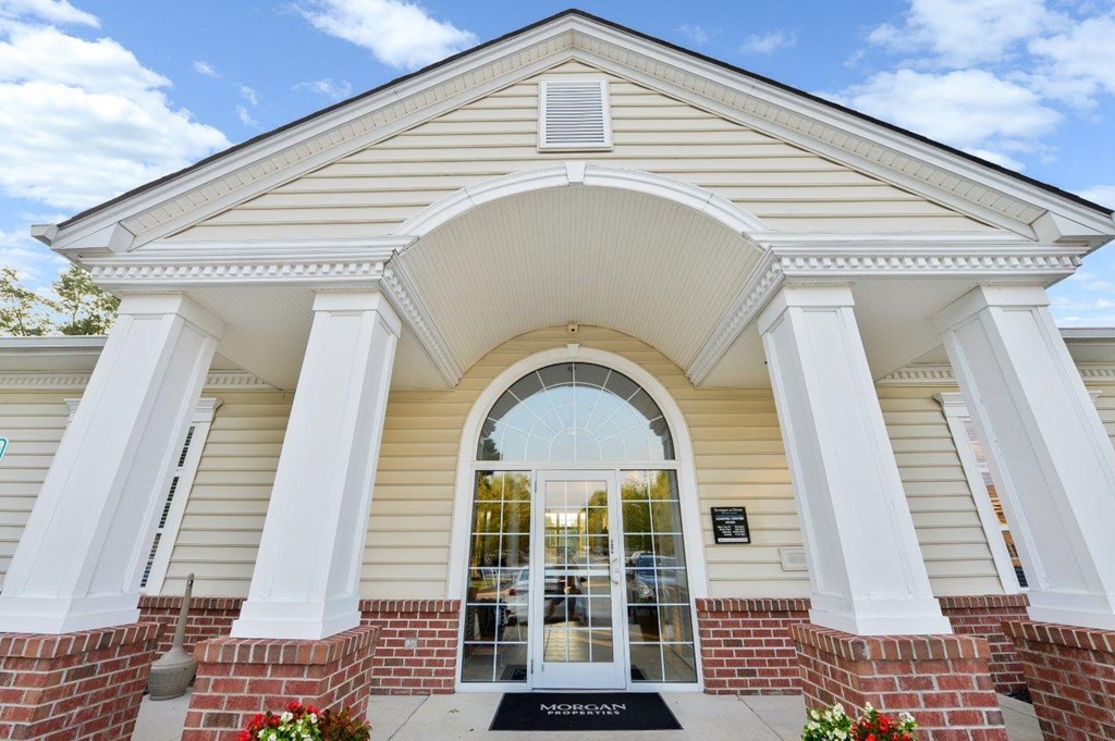 the front of a building with a large window