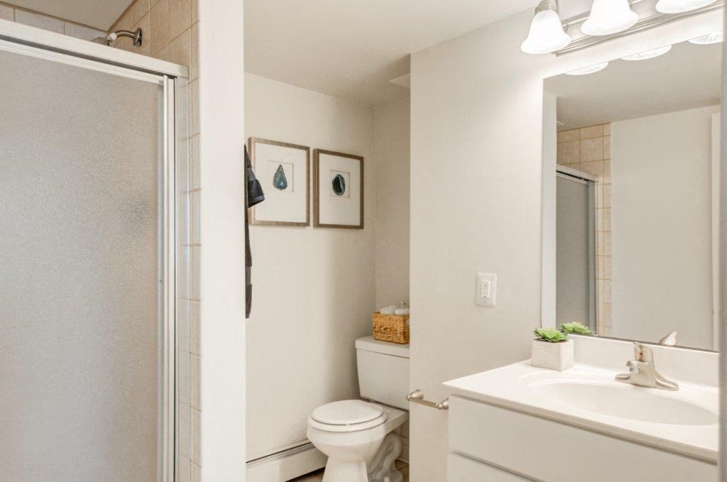 a bathroom with a sink toilet and a shower
