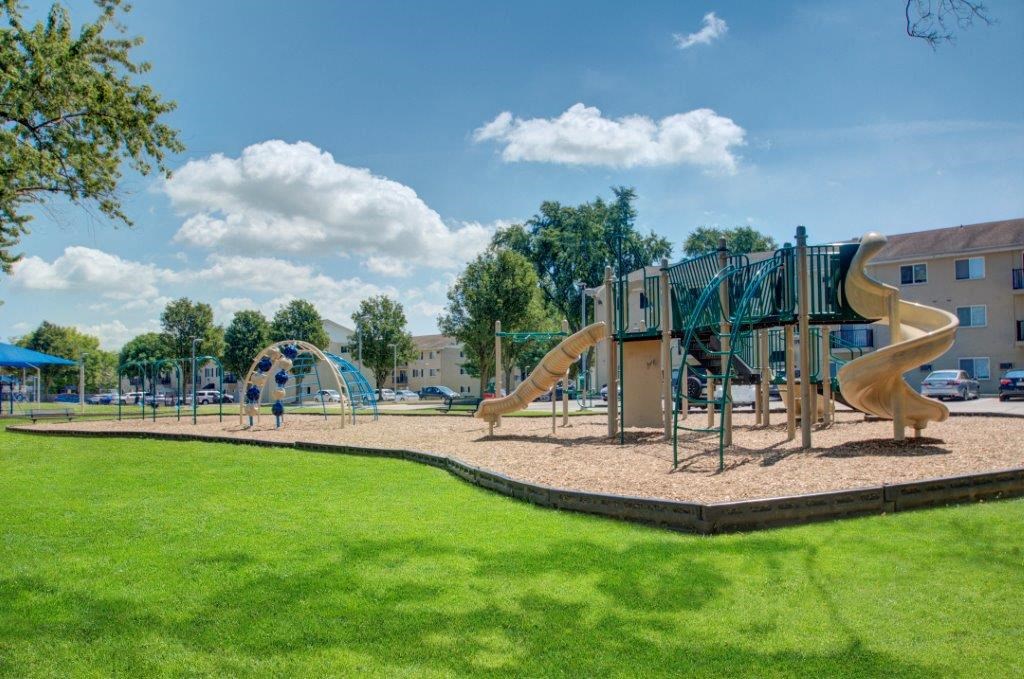 a playground with slides on a sunny day
