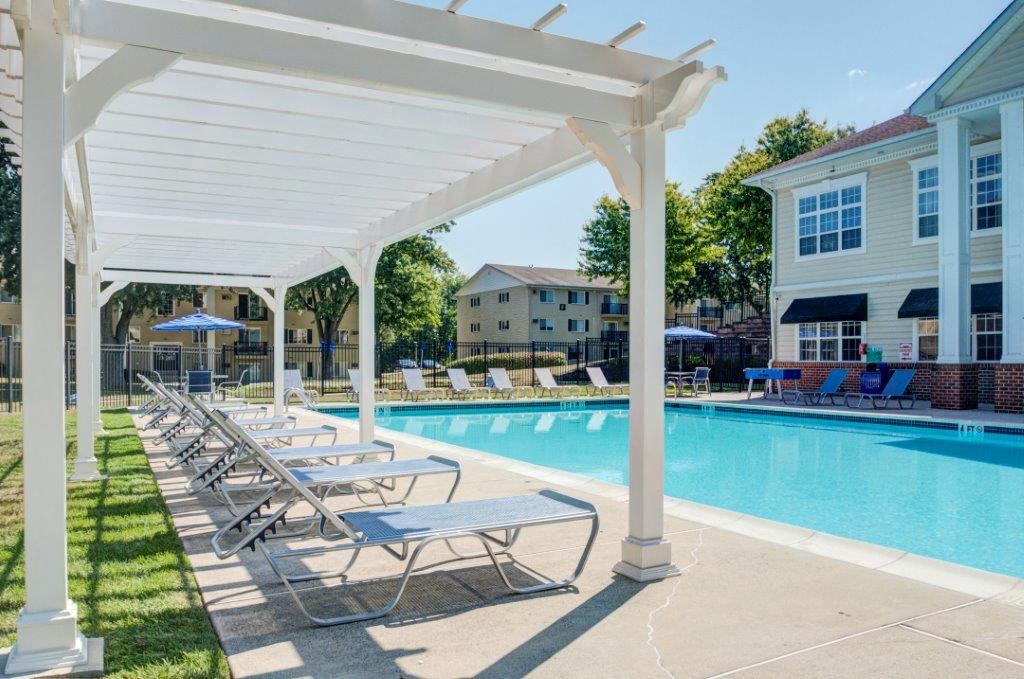 our apartments have a pool and covered area with lounge chairs
