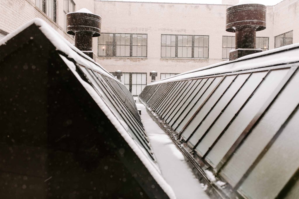 a view of the snow covered roof of a train