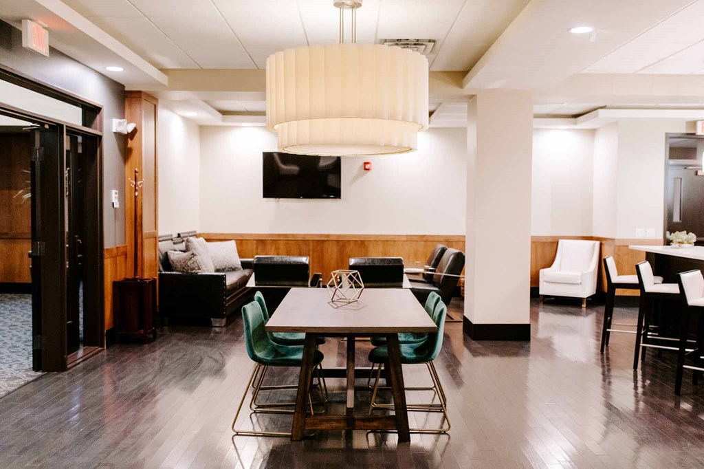 a dining room with a table and chairs