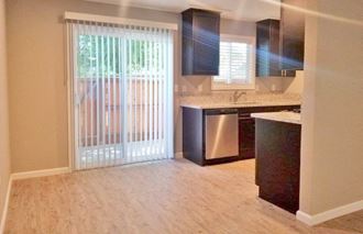 Dining room View of dining and kitchen area and sliding glass door leading to private patio - Photo Gallery