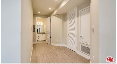 a large hallway with a bathroom and a closet