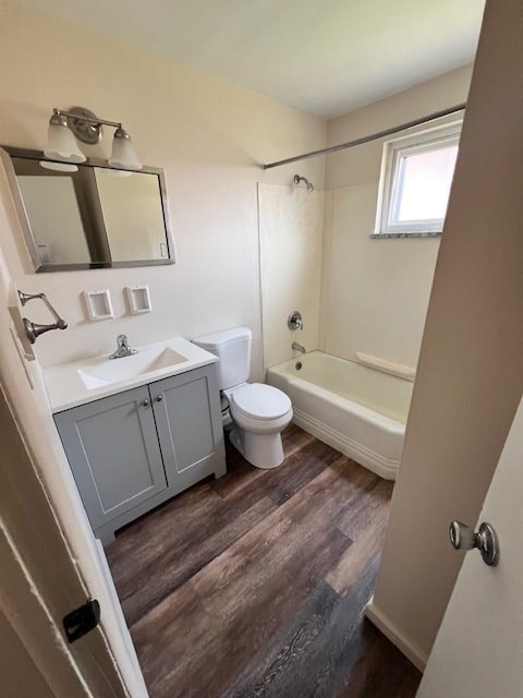 A small bathroom with a toilet, sink, and bathtub.
