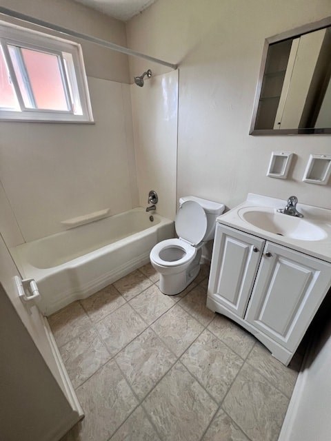 A white bathroom with a toilet, sink, and bathtub.